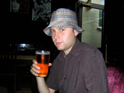 The author wearing his Chav burberry hat. Thanks to Alex for the hat.