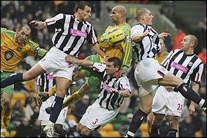 Norwich and West Bromwich Albion footballers suspended in mid air as if by strings, Saturday 5th Feb 2005