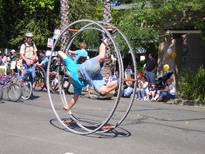 Man rolling in a big wheel