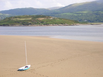 A sailboat lies beached at low tide, Portmeirion, 5th September 2005