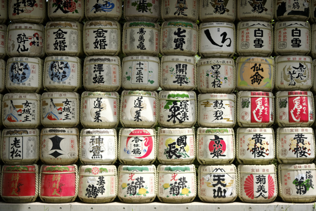 Image of rows of consecrated sake barrels stacked up at Meiji Jingu shrine, Tokyo.